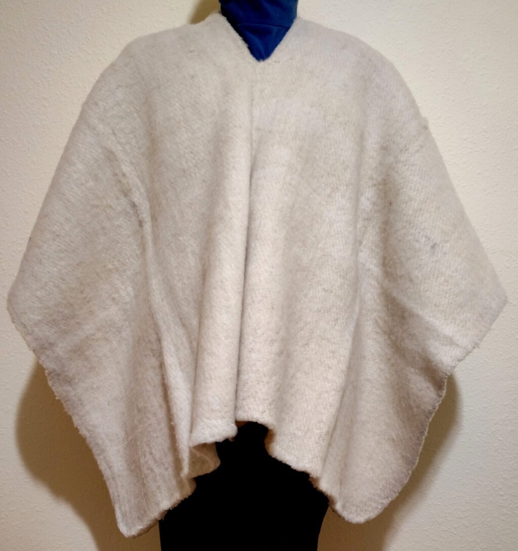 Classic White Unisex Ruana A classic white Ruana for both men and women made of pure wool.