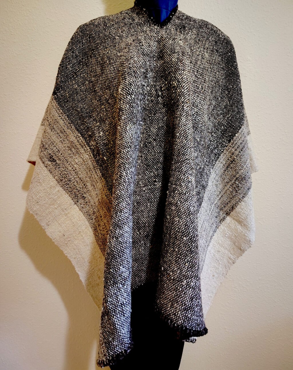 Elegant Poncho Made From Pure Wool This elegant poncho is 100% hand-woven wool with three shades of natural color.