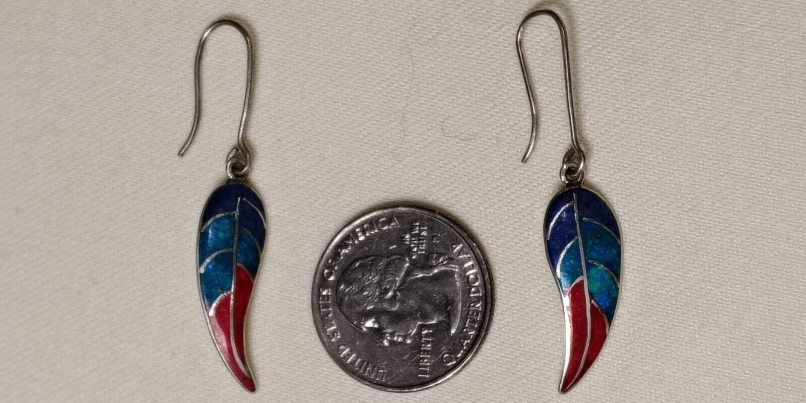 Dangle earrings with a quarter to show size
