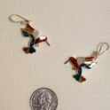 Hummingbird earrings with a quarter to show size.
