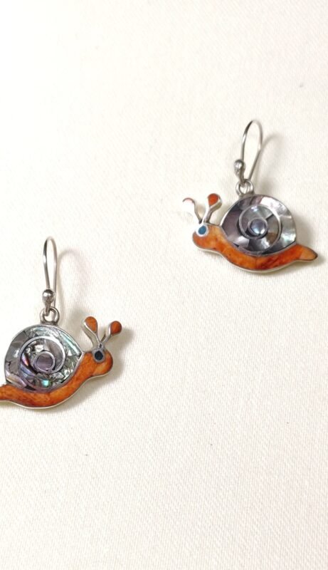 Silver snail earrings with abalone inlay and shepherd hook backing.